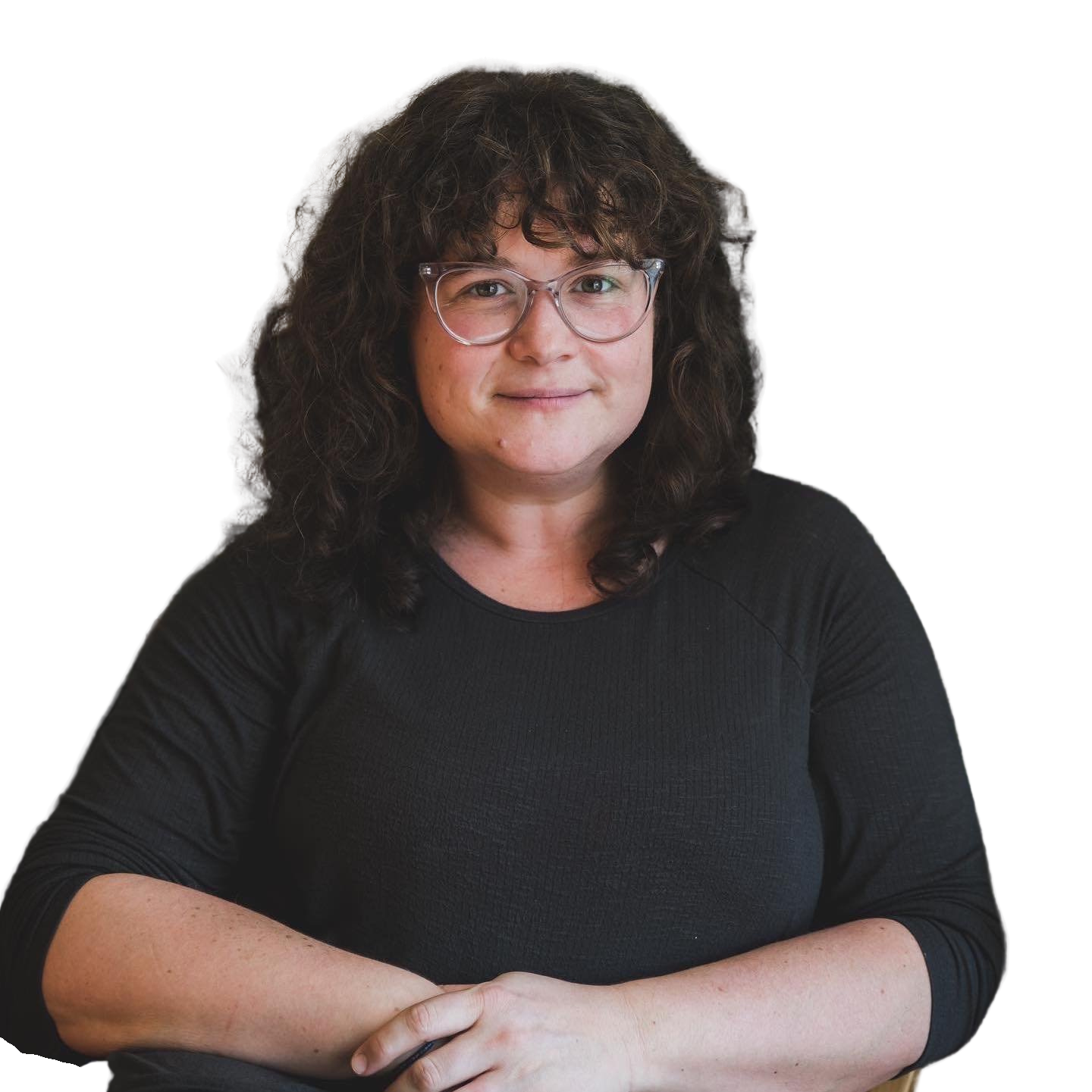 Laila O'Boyle, smiling with her arms crossed
