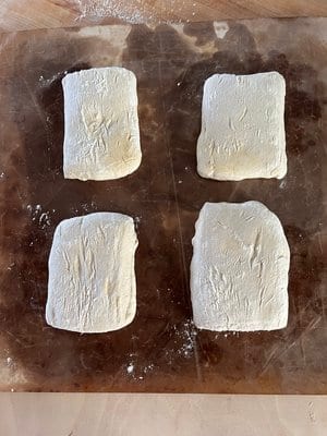 Cut into four and resting before the bake