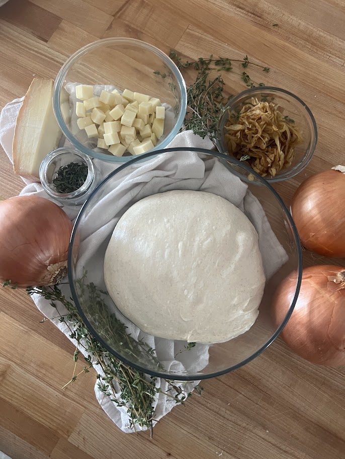Everything you need: dough, caramelized onions, cubed Gruyère, fresh thyme