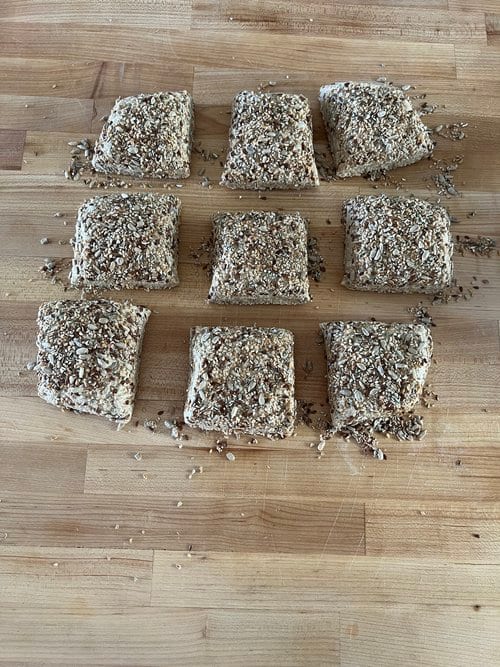 Cut into nine and pressed into the loose seeds