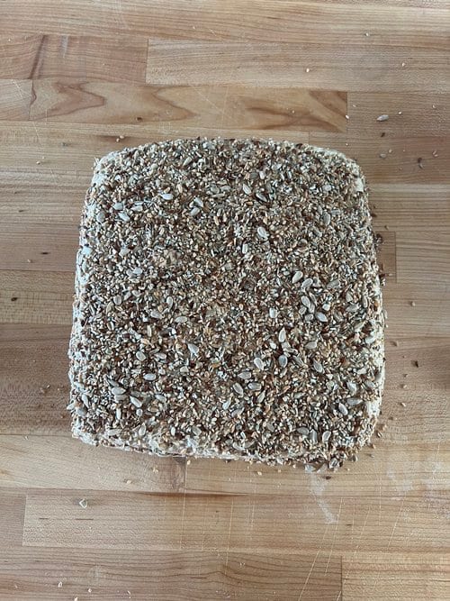 Out of the fridge and covered in seeds, before cutting